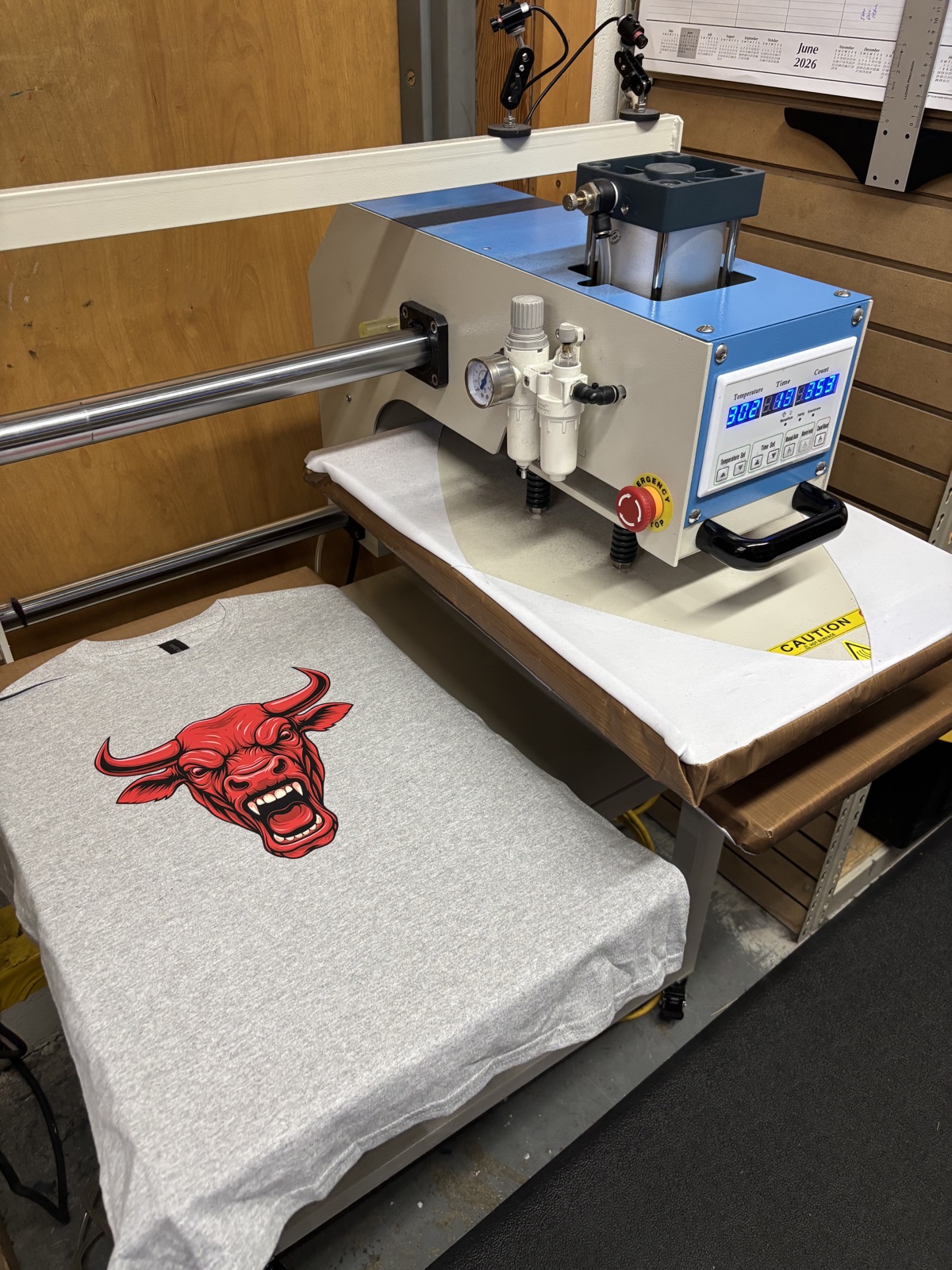 DTF printing dual heat press with bull shirt at CustomTees