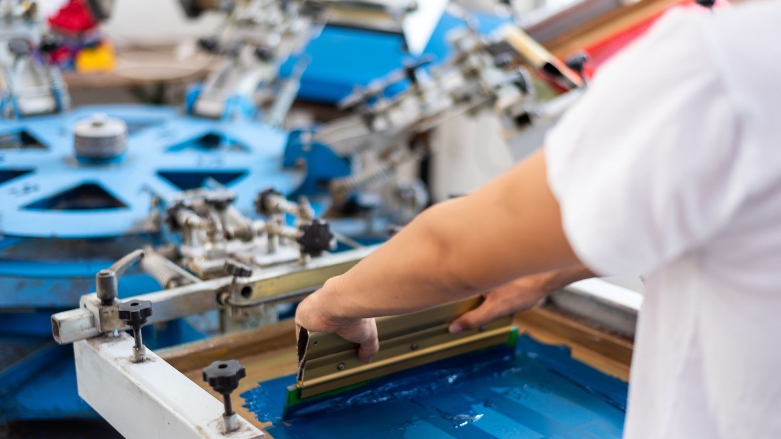 Screen printing equipment at CustomTees